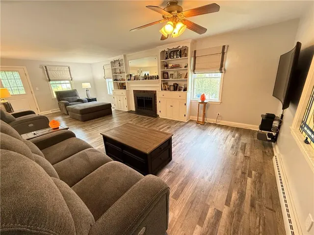 a bedroom with furniture window and flat screen tv