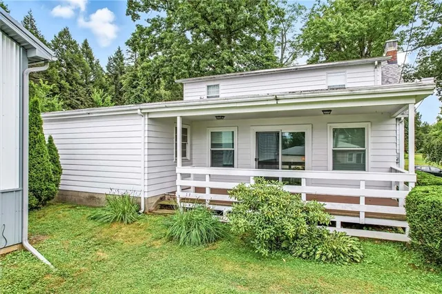 a view of a house with a small garden