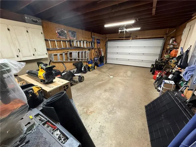 a view of backyard and garage