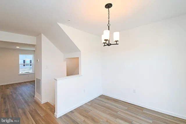 a view of a kitchen with wooden floor