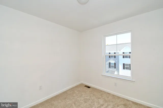 a view of a balcony with wooden fence and floor