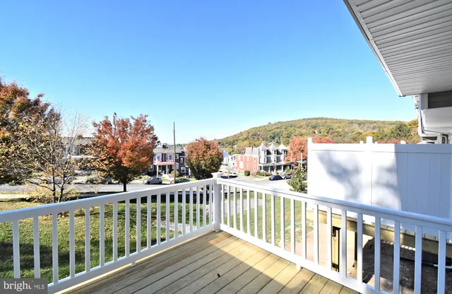 a view of a brick building with many windows