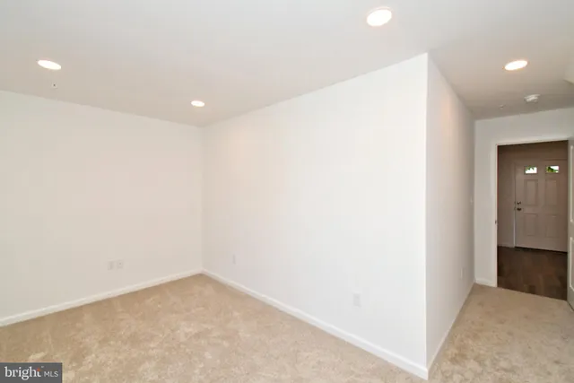 a kitchen with stainless steel appliances granite countertop a sink a stove and a wooden floors