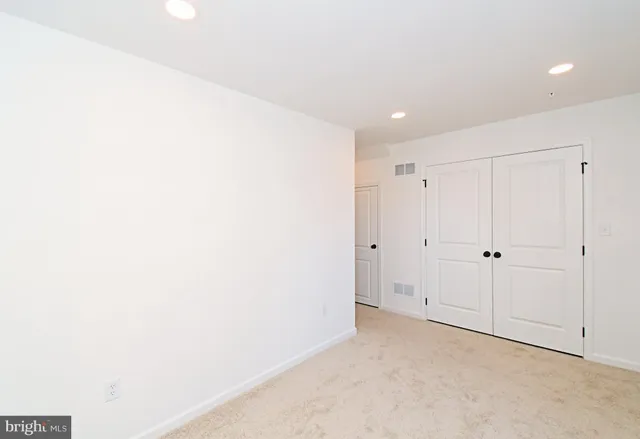 a kitchen with granite countertop a sink a counter space appliances and cabinets