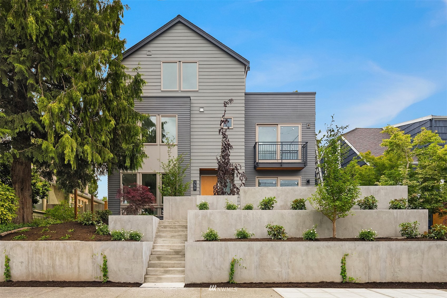 750 North 68th Street, Unit B Seattle, WA 98103 - Photo 1 of 19 front view of a house and a street