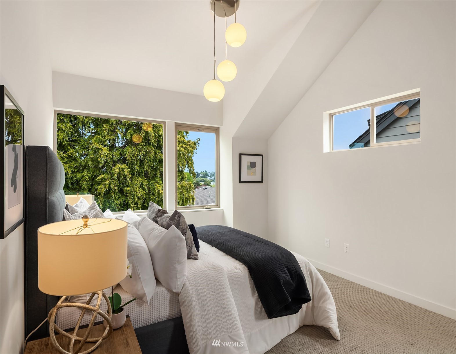 750 North 68th Street, Unit B Seattle, WA 98103 - Photo 14 of 19 a bedroom with a bed and wooden floor