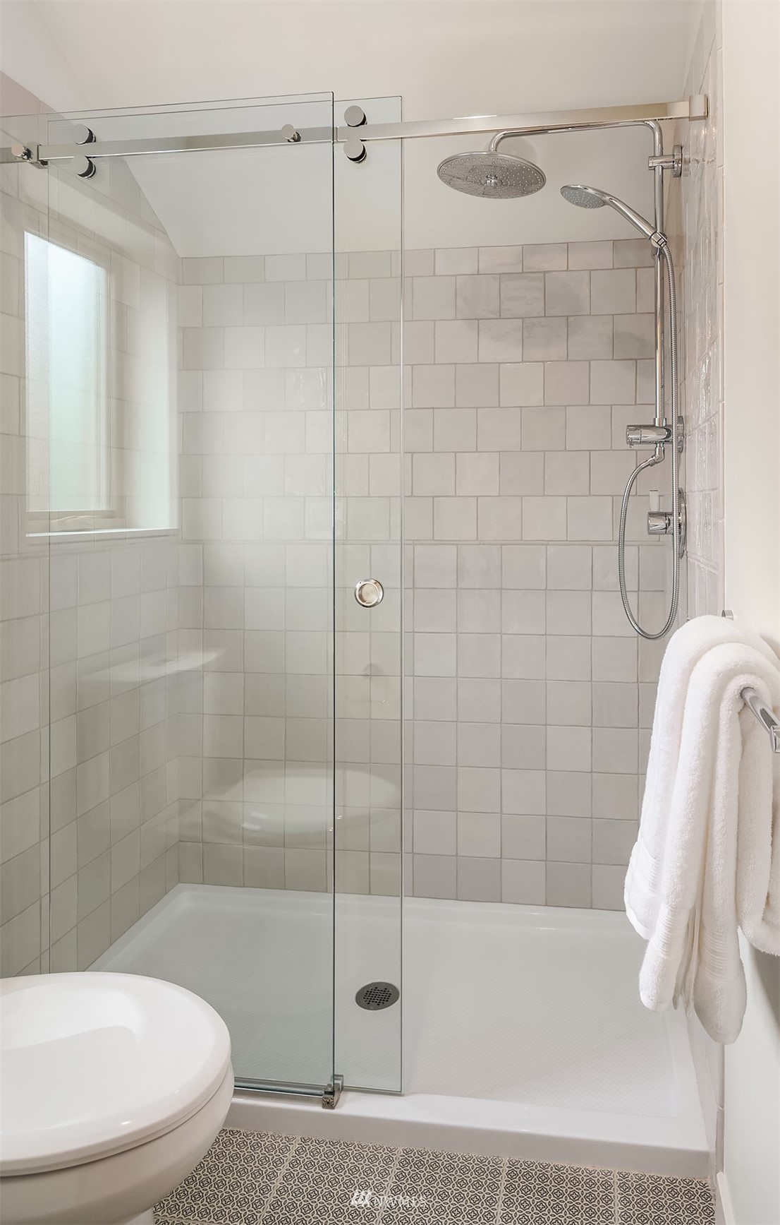 750 North 68th Street, Unit B Seattle, WA 98103 - Photo 16 of 19 a bathroom with a shower and toilet