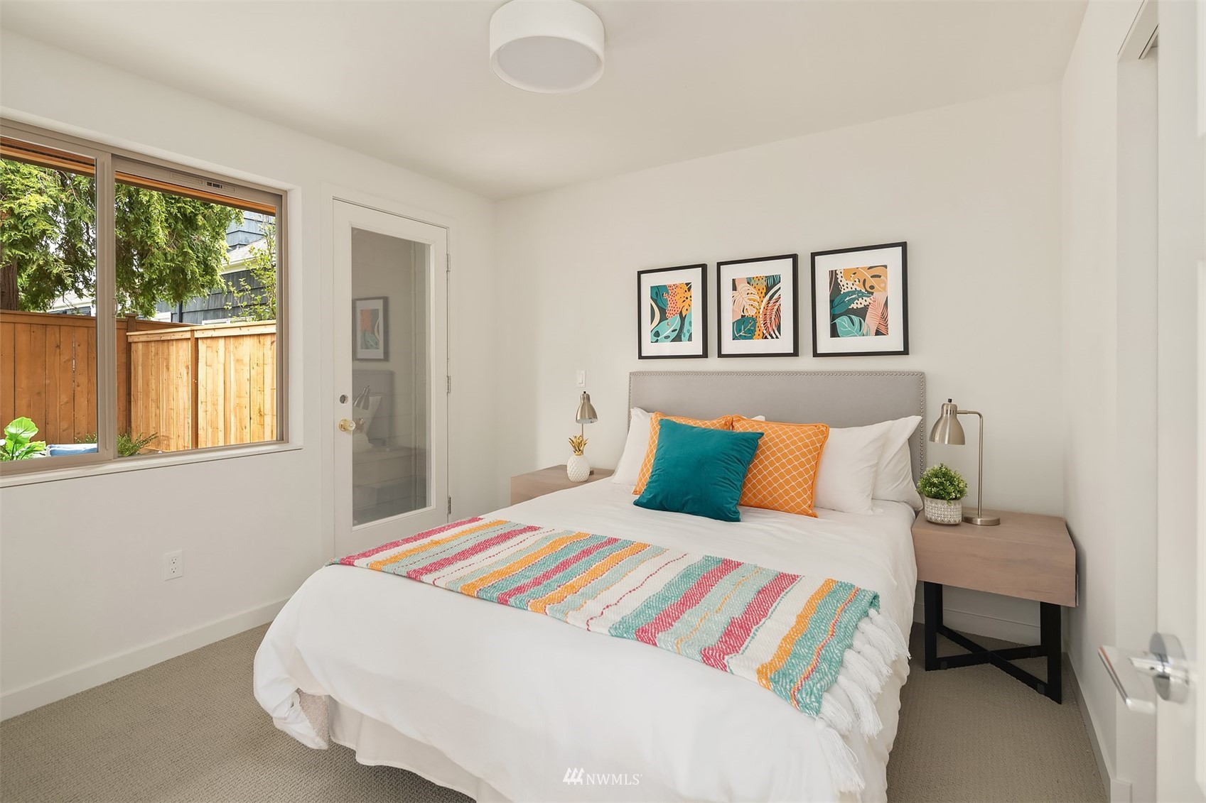 750 North 68th Street, Unit B Seattle, WA 98103 - Photo 5 of 19 a bedroom with a bed and a painting on the wall