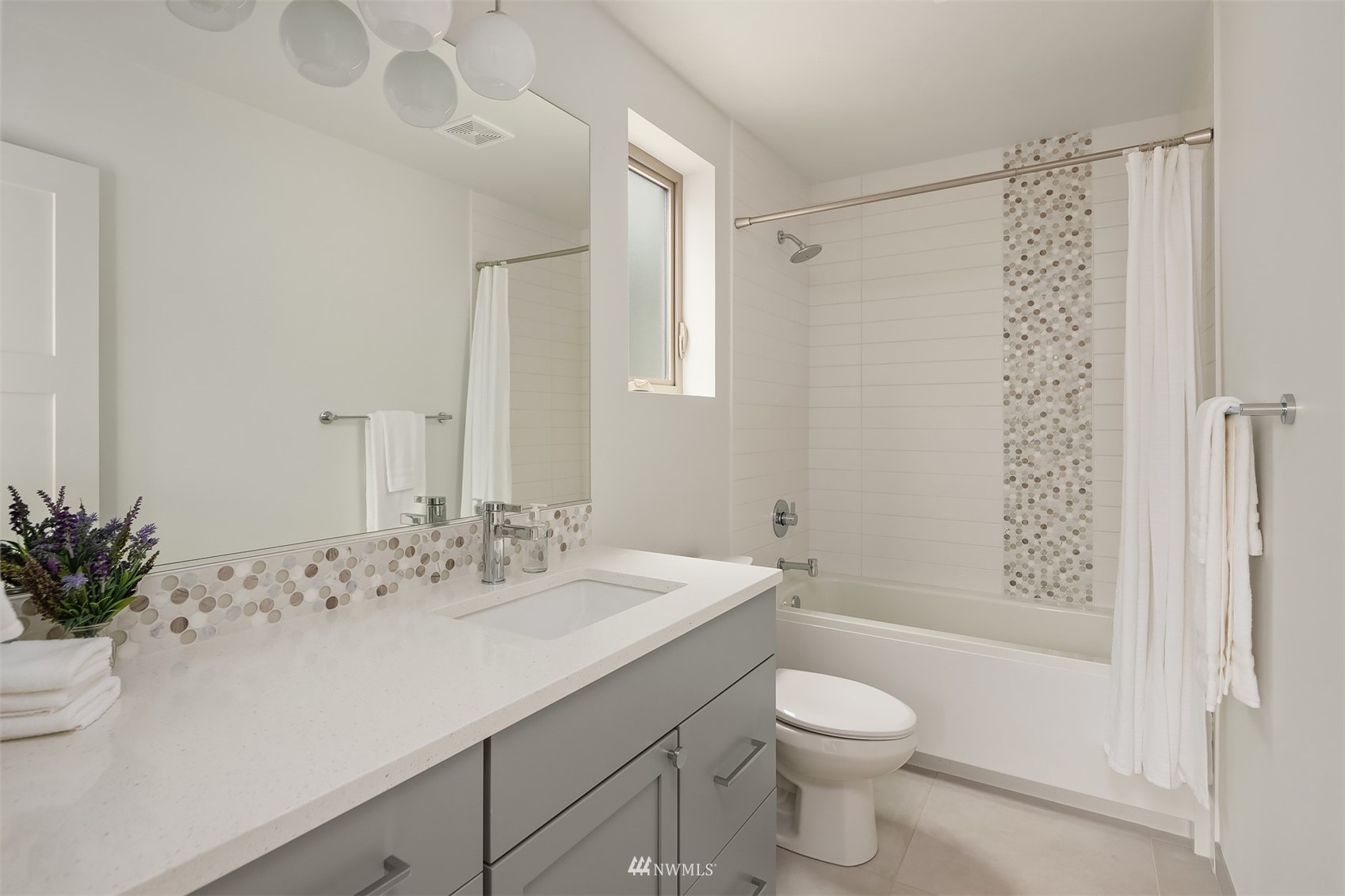 750 North 68th Street, Unit B Seattle, WA 98103 - Photo 6 of 19 a bathroom with a sink a toilet and shower