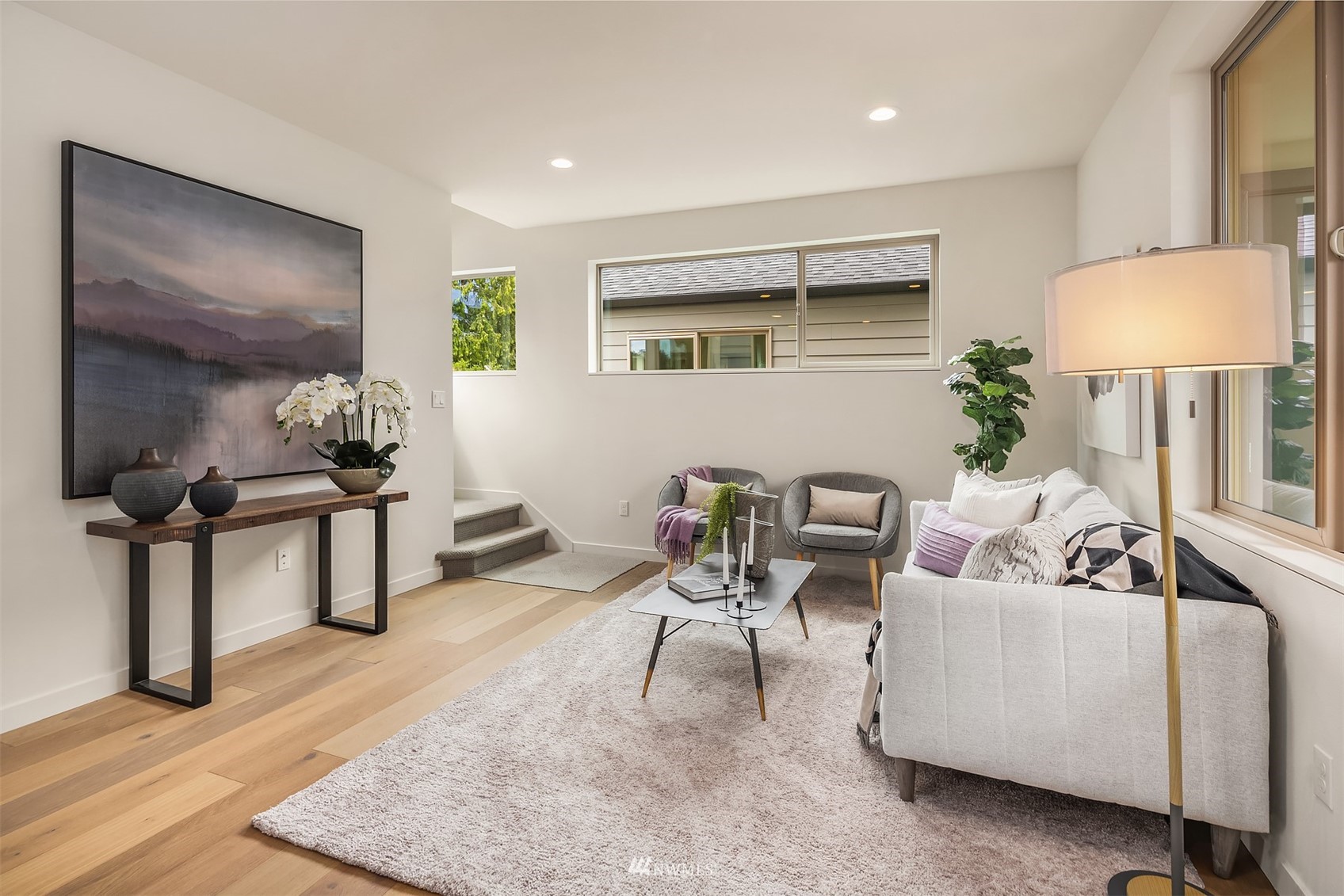 750 North 68th Street, Unit B Seattle, WA 98103 - Photo 8 of 19 a living room with furniture and a lamp