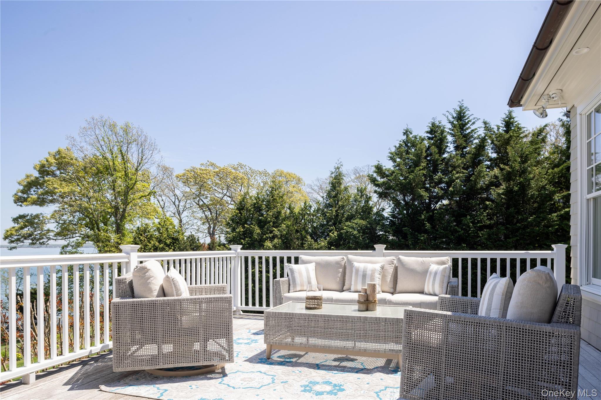 3745 Nassau Point Road Cutchogue, NY 11935 - Photo 19 of 36 Wooden terrace with outdoor lounge area