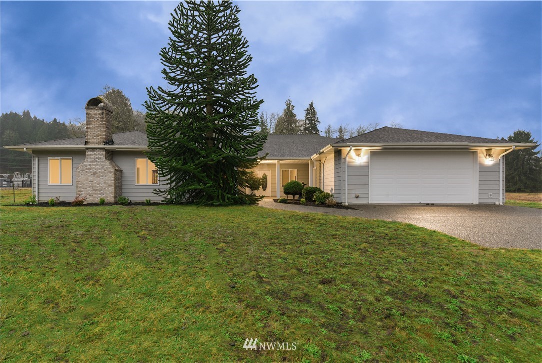 23020 Oso Loop Road Arlington, WA 98223 - Photo 1 of 19 a front view of house with a garden