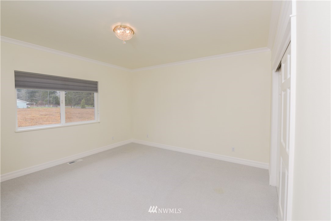 23020 Oso Loop Road Arlington, WA 98223 - Photo 14 of 19 a view of an empty room with a window