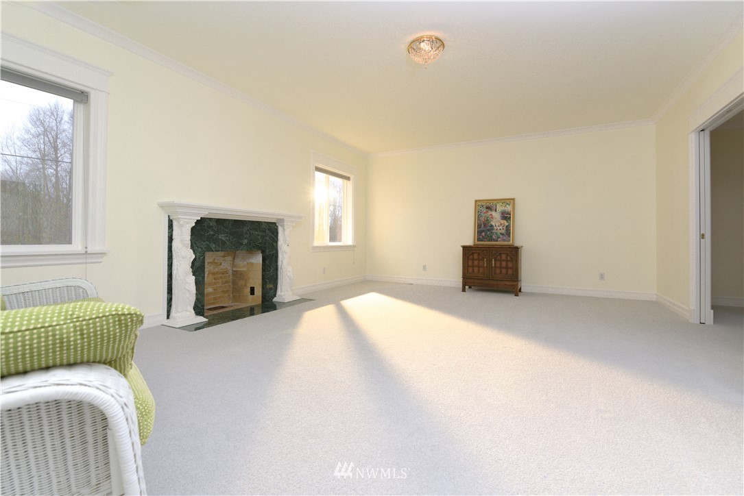 23020 Oso Loop Road Arlington, WA 98223 - Photo 6 of 19 a bedroom with a bed and a mirror