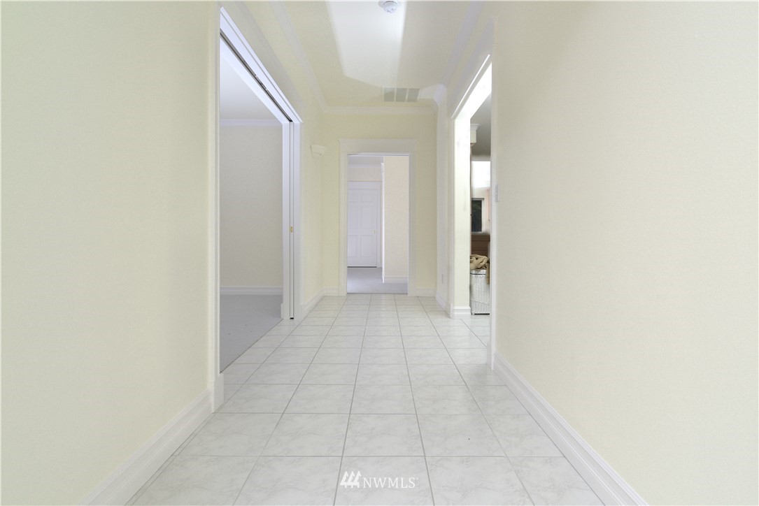 23020 Oso Loop Road Arlington, WA 98223 - Photo 7 of 19 a view of a hallway with wooden floor