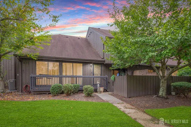 a view of an house with backyard space and garden
