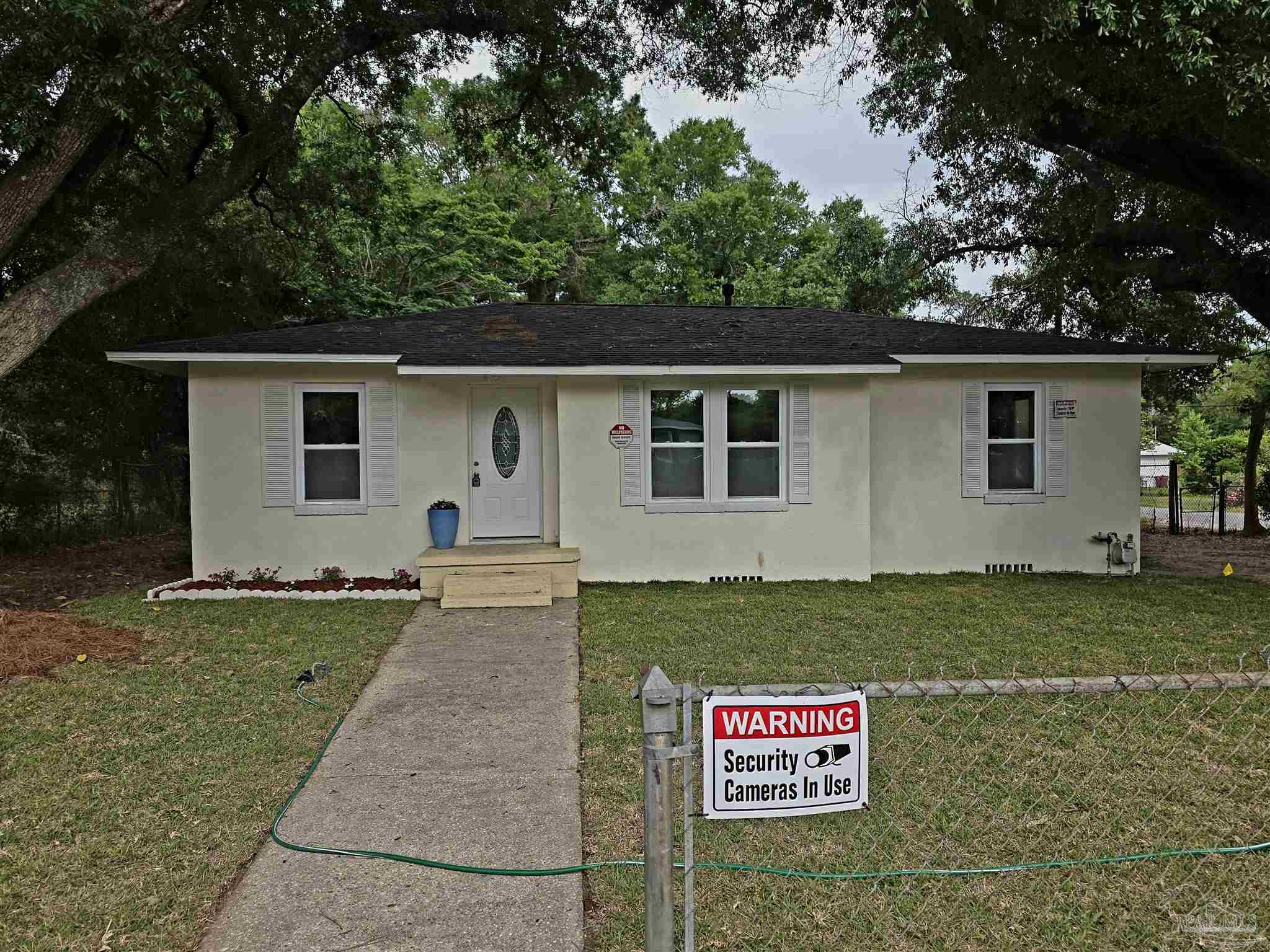a view of a back yard of the house