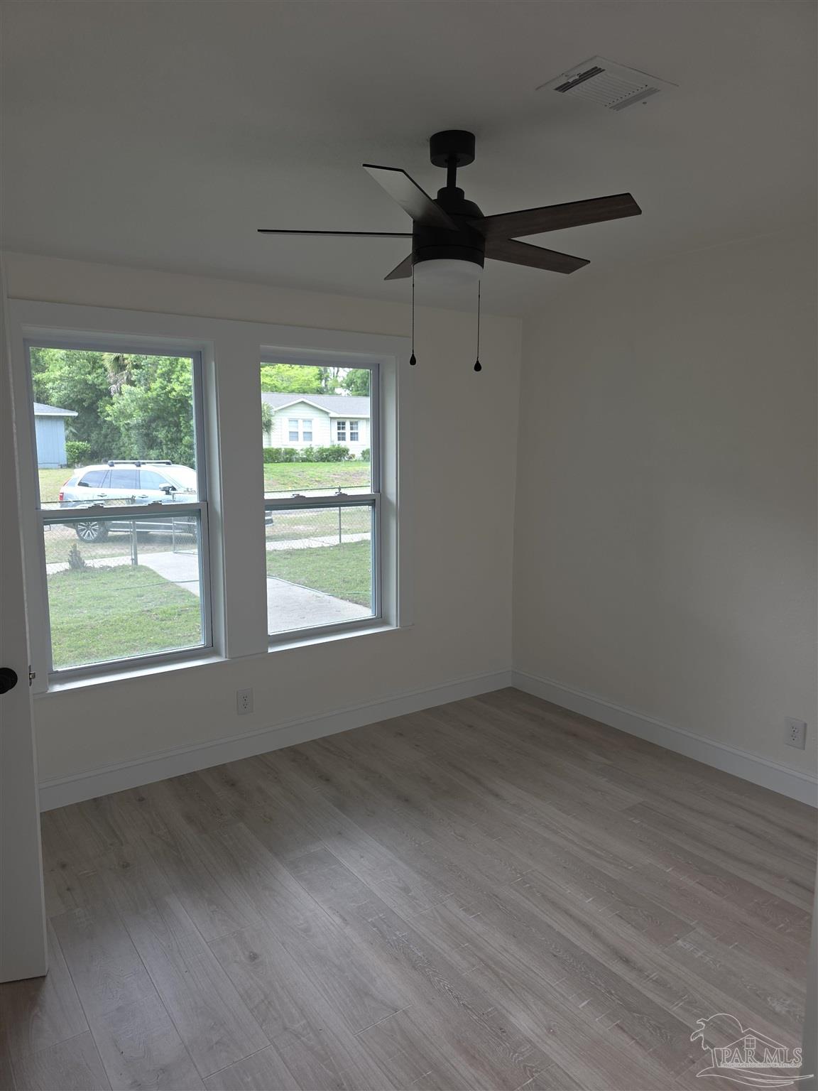 302 Dixie Street Crestview, FL 32536 - Photo 14 of 17 an empty room with a window