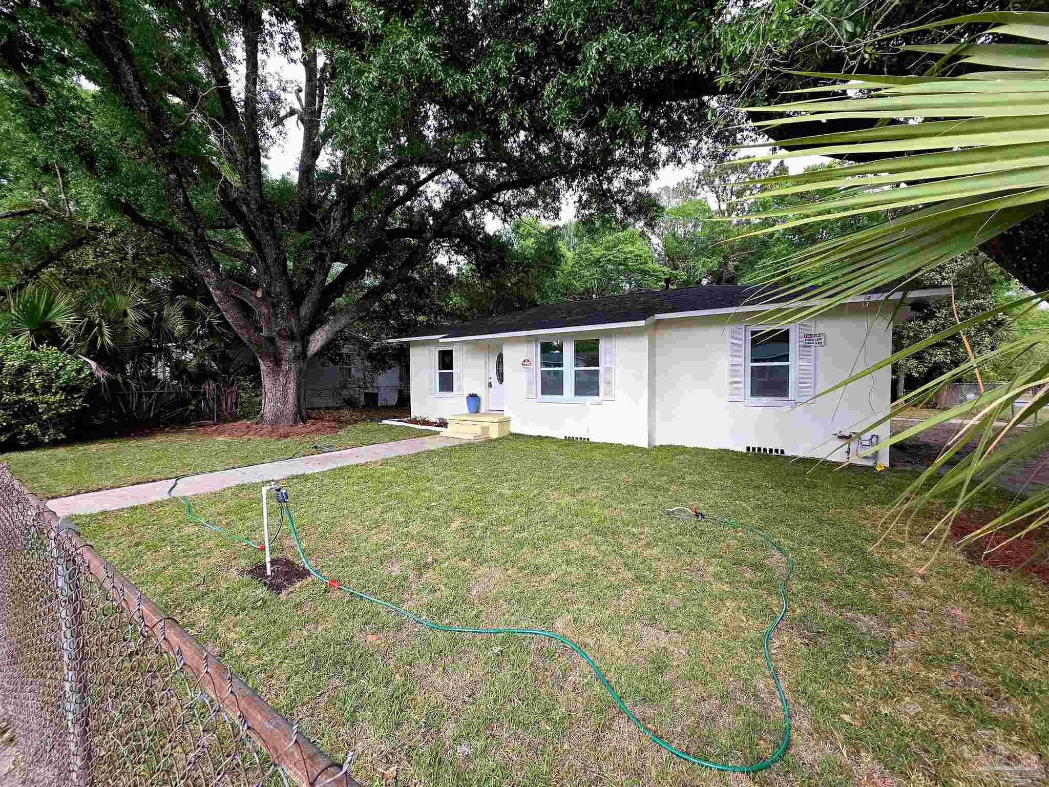 302 Dixie Street Crestview, FL 32536 - Photo 2 of 17 a view of a house with a backyard