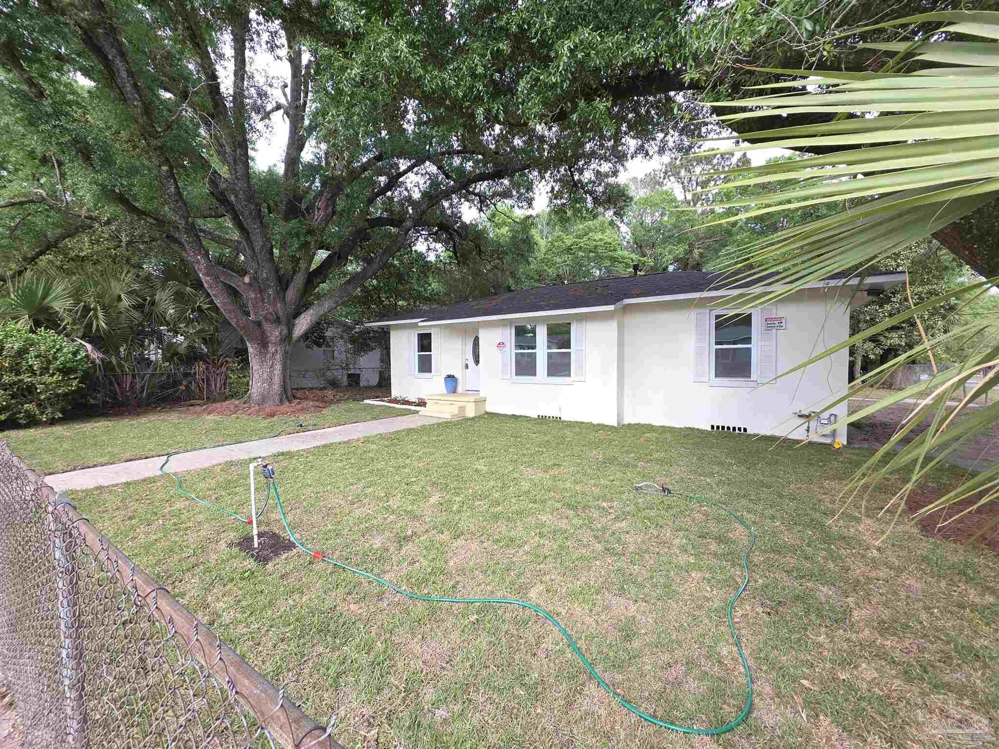 302 Dixie Street Crestview, FL 32536 - Photo 3 of 17 a view of a house with a backyard