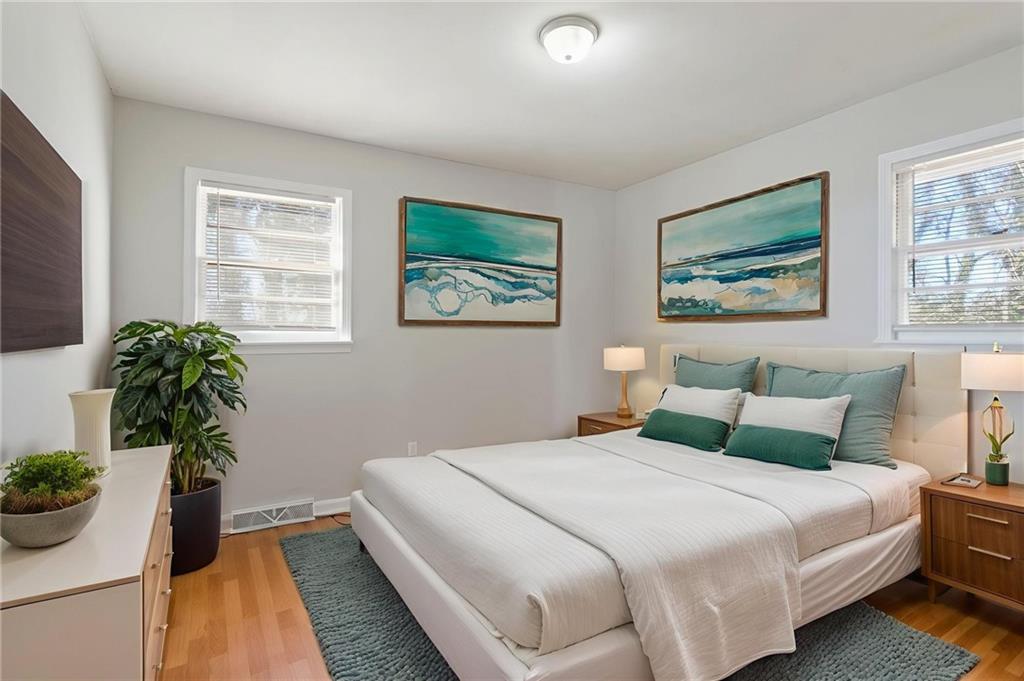 419 East 13th Street Rome, GA 30161 - Photo 16 of 27 a bedroom with bed and a potted plant