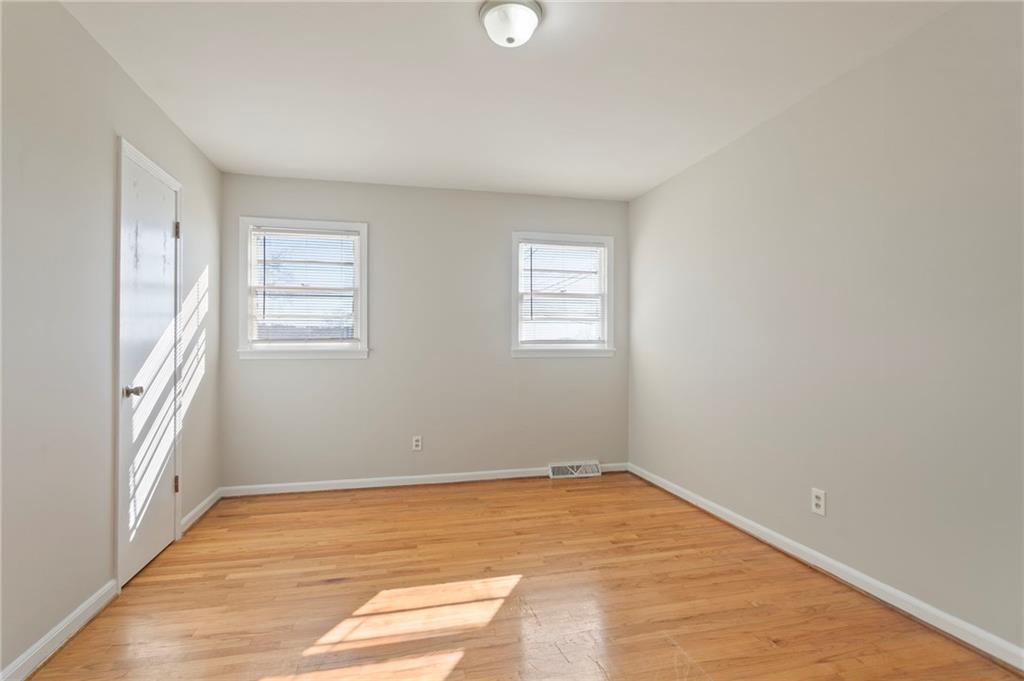 419 East 13th Street Rome, GA 30161 - Photo 19 of 27 a view of empty room with wooden floor and fan