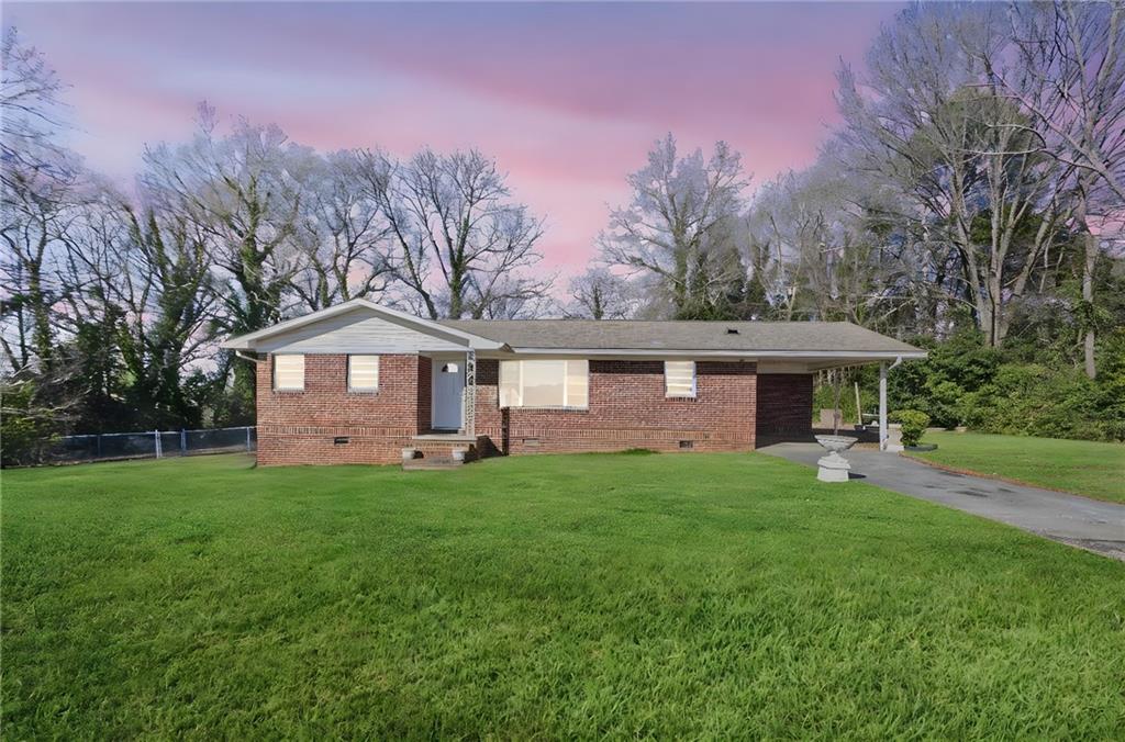 419 East 13th Street Rome, GA 30161 - Photo 2 of 27 a front view of a house with a yard