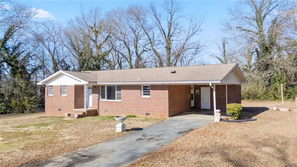 419 East 13th Street Rome, GA 30161 - Photo 23 of 27 a view of a house with a yard covered in snow