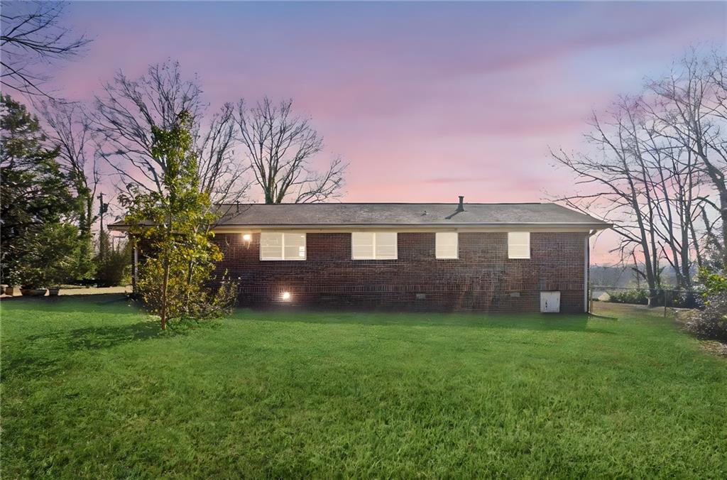 419 East 13th Street Rome, GA 30161 - Photo 3 of 27 a front view of a house with a yard