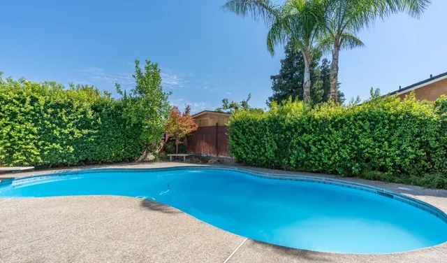 a view of a swimming pool and an outdoor space