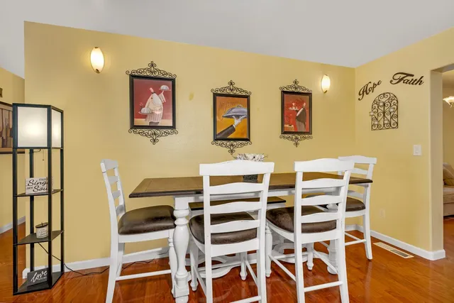 a view of a livingroom with furniture and wooden floor