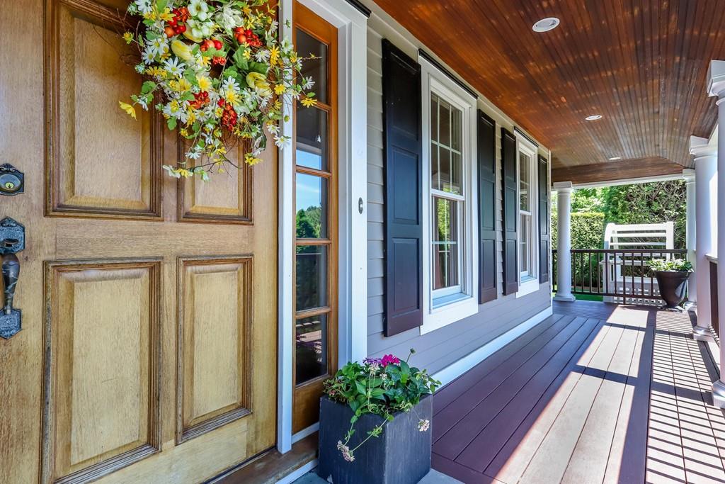 6 Colonial Lane Canton, MA 02021 - Photo 4 of 42 a porch with wooden floor