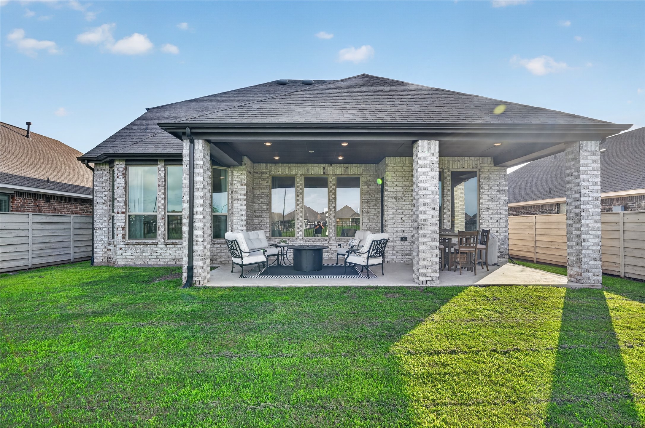 4439 Stone Ridge Lane Manvel, TX 77578 - Photo 44 of 48 a view of a house with a backyard and sitting area