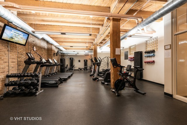 1040 West Adams Street, Unit 444 Chicago, IL 60607 - Photo 5 of 6 a view of a room with gym equipment