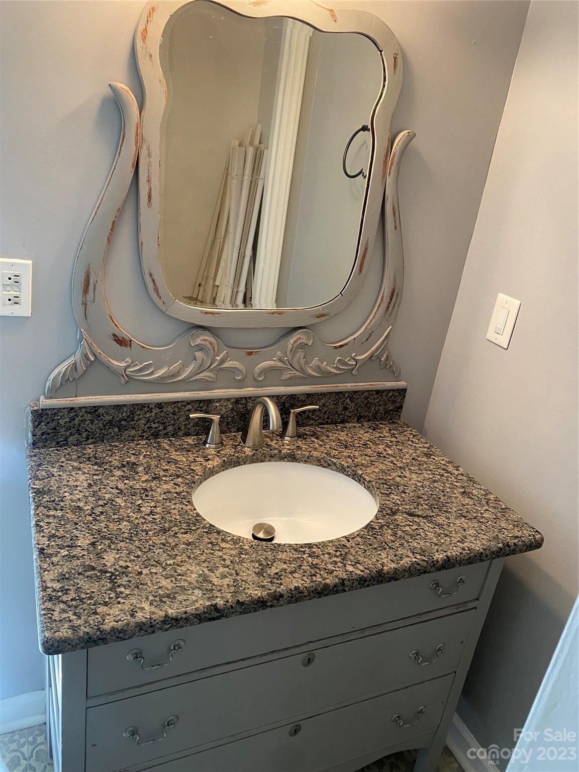 17183 Pond Road Locust, NC 28097 - Photo 13 of 14 a bathroom with a granite countertop sink and a mirror