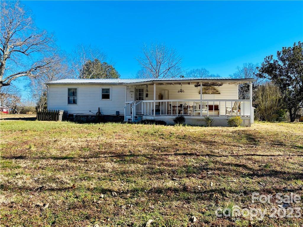 17183 Pond Road Locust, NC 28097 - Photo 14 of 14 a view of a house with a yard covered with snow