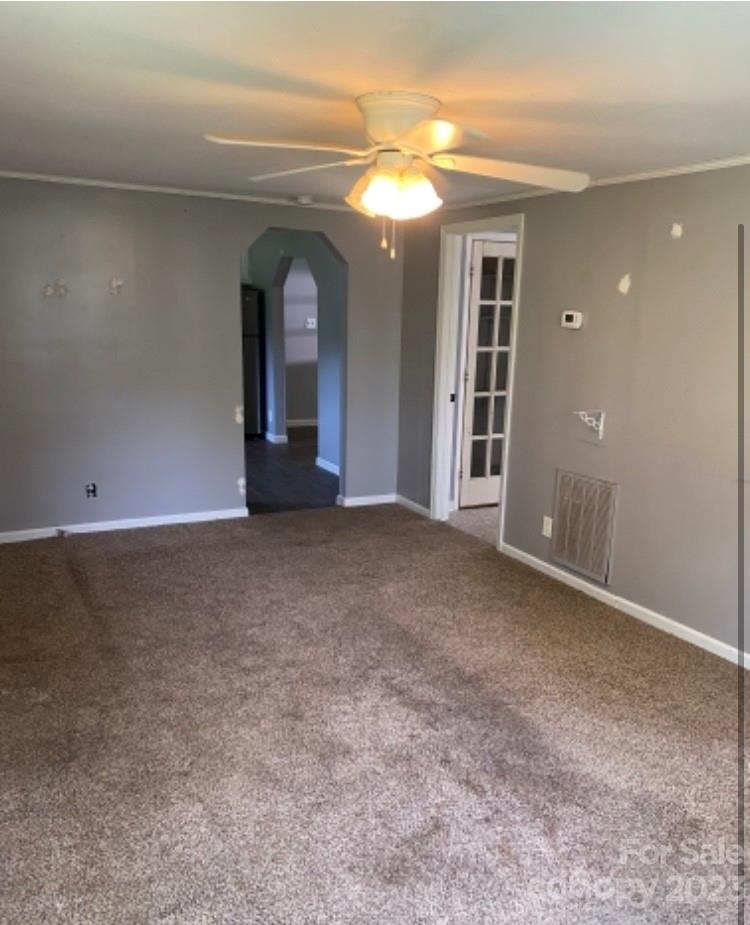 17183 Pond Road Locust, NC 28097 - Photo 3 of 14 a view of a big room with windows and chandelier