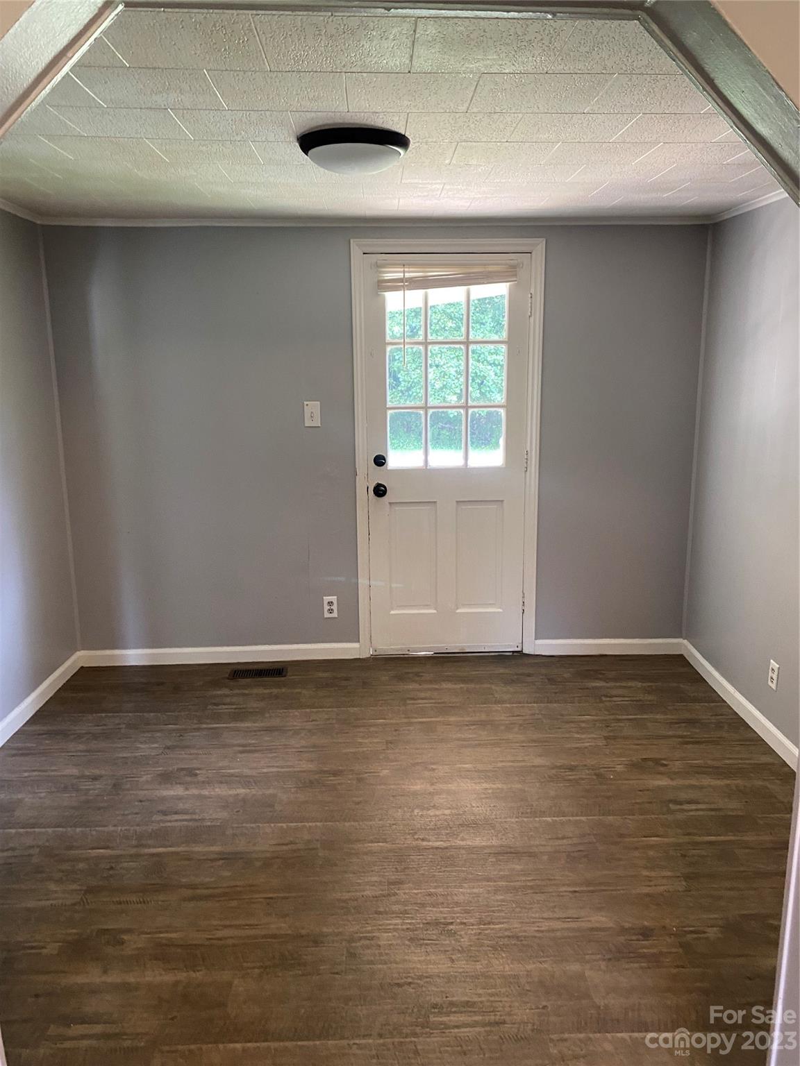 17183 Pond Road Locust, NC 28097 - Photo 8 of 14 a view of a room with wooden floor and window