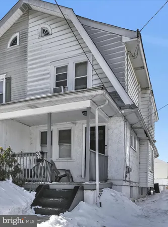 a front view of a house with garage