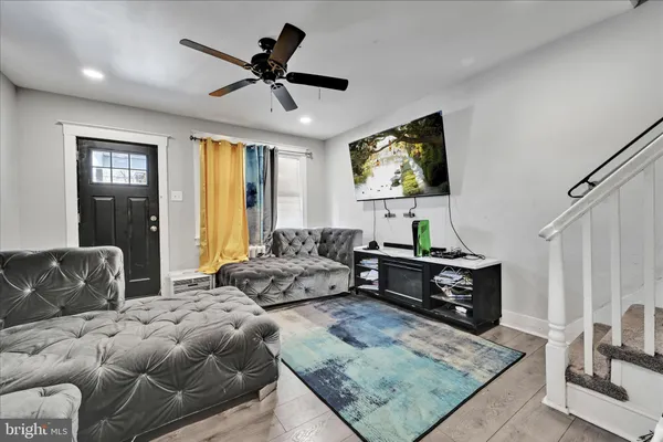 a living room with furniture and a rug