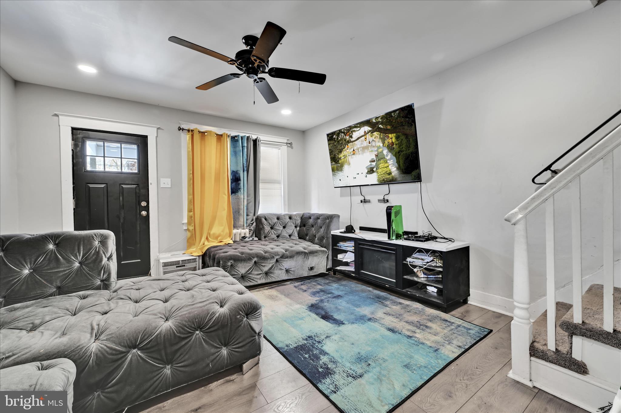 204 East Avon Road Brookhaven, PA 19015 - Photo 5 of 26 a living room with furniture and a rug