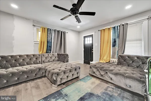 a bedroom with a large bed and a couch