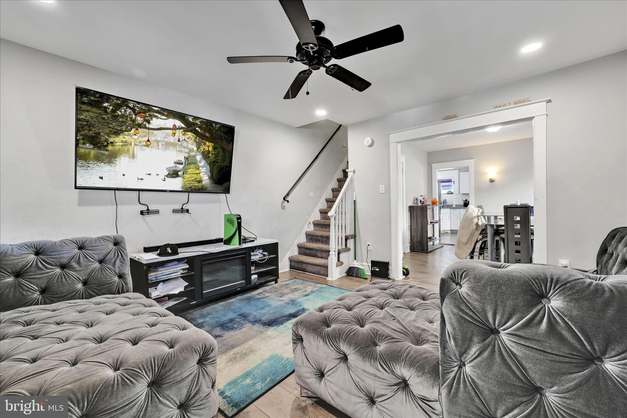 204 East Avon Road Brookhaven, PA 19015 - Photo 7 of 26 a living room with furniture and wooden floor