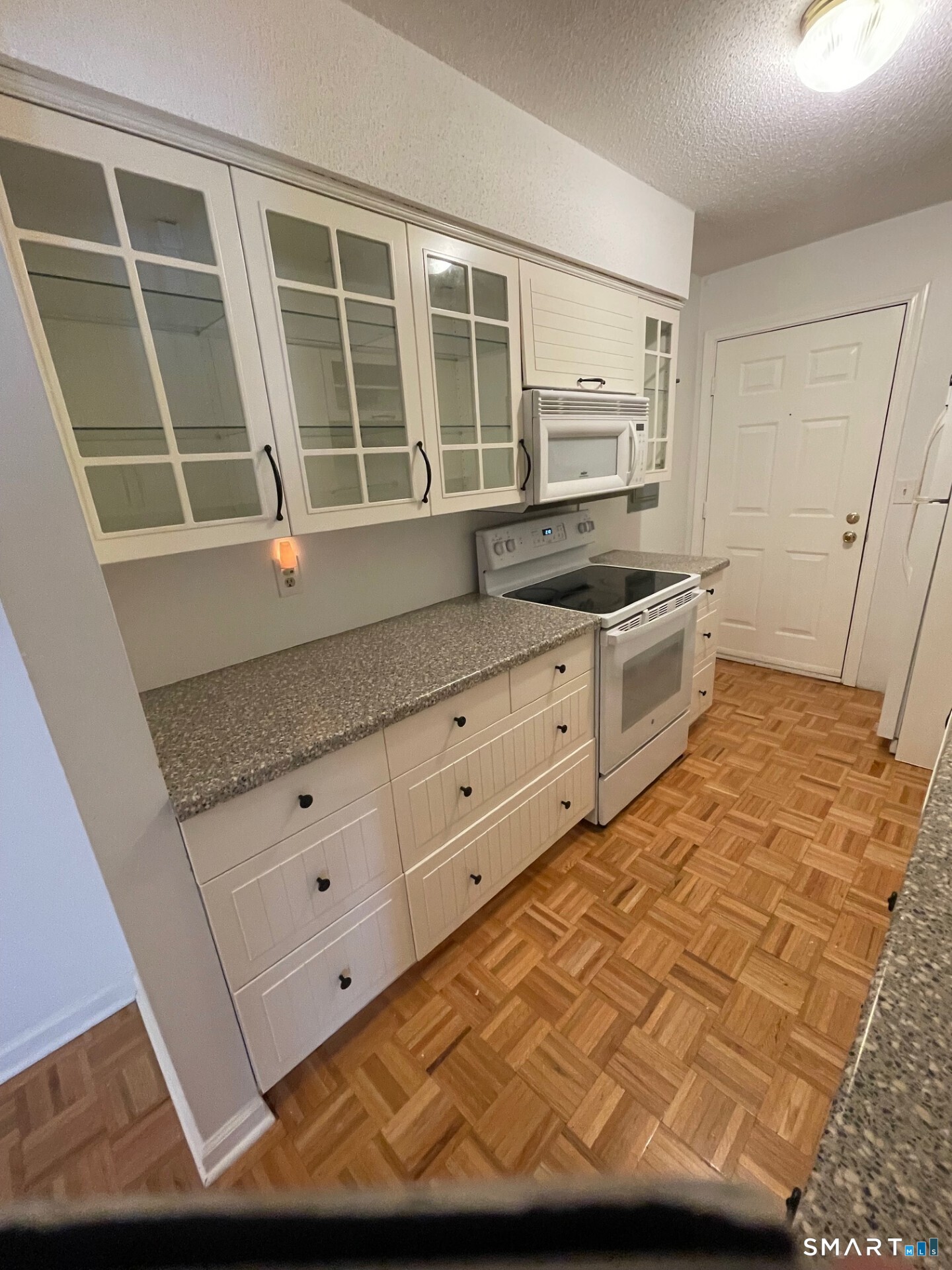 1 Concorde Way, Unit B4 Windsor Locks, CT 06096 - Photo 2 of 40 a kitchen with granite countertop a sink and a stove