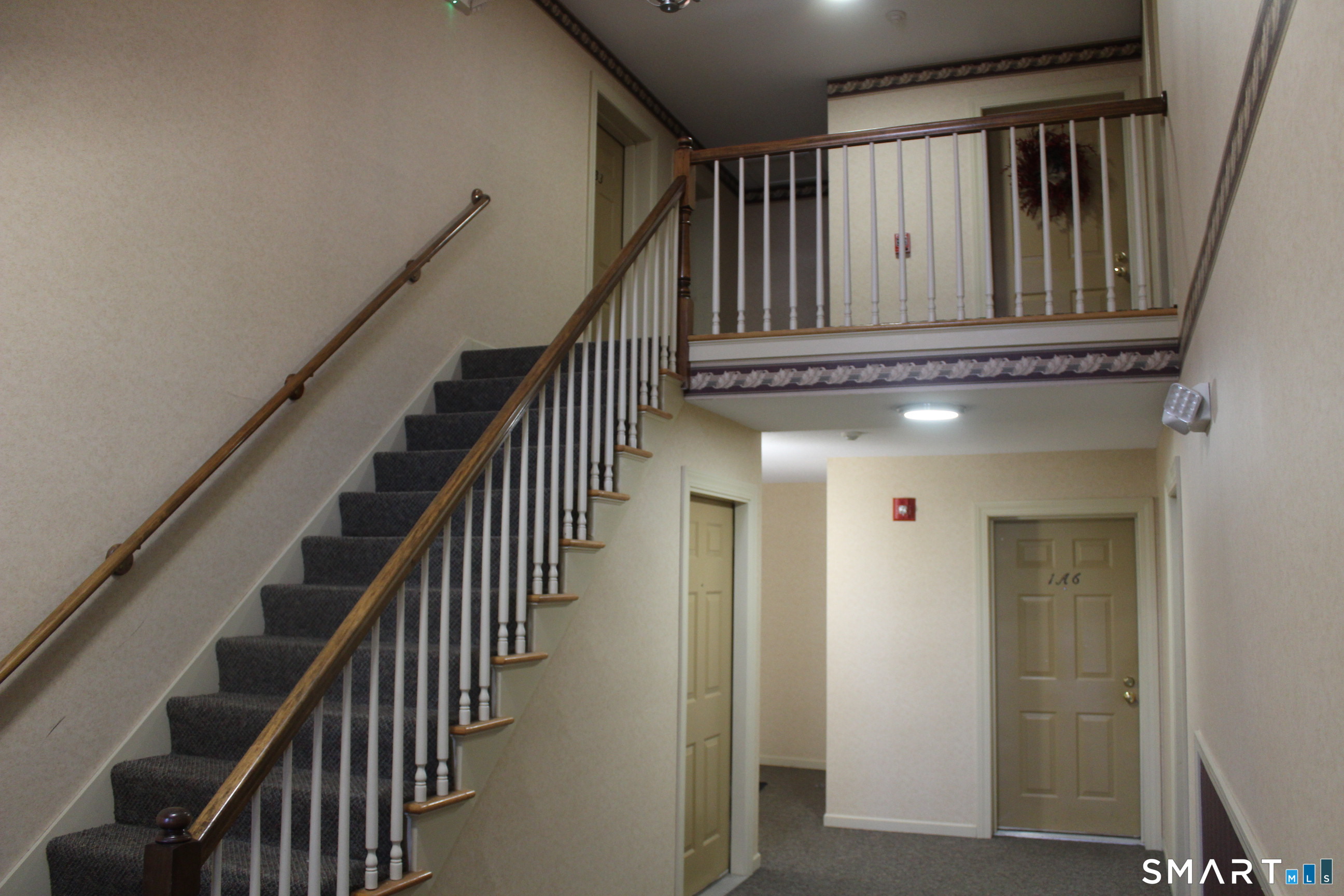 1 Concorde Way, Unit B4 Windsor Locks, CT 06096 - Photo 21 of 40 an entryway with wooden floor and stairs