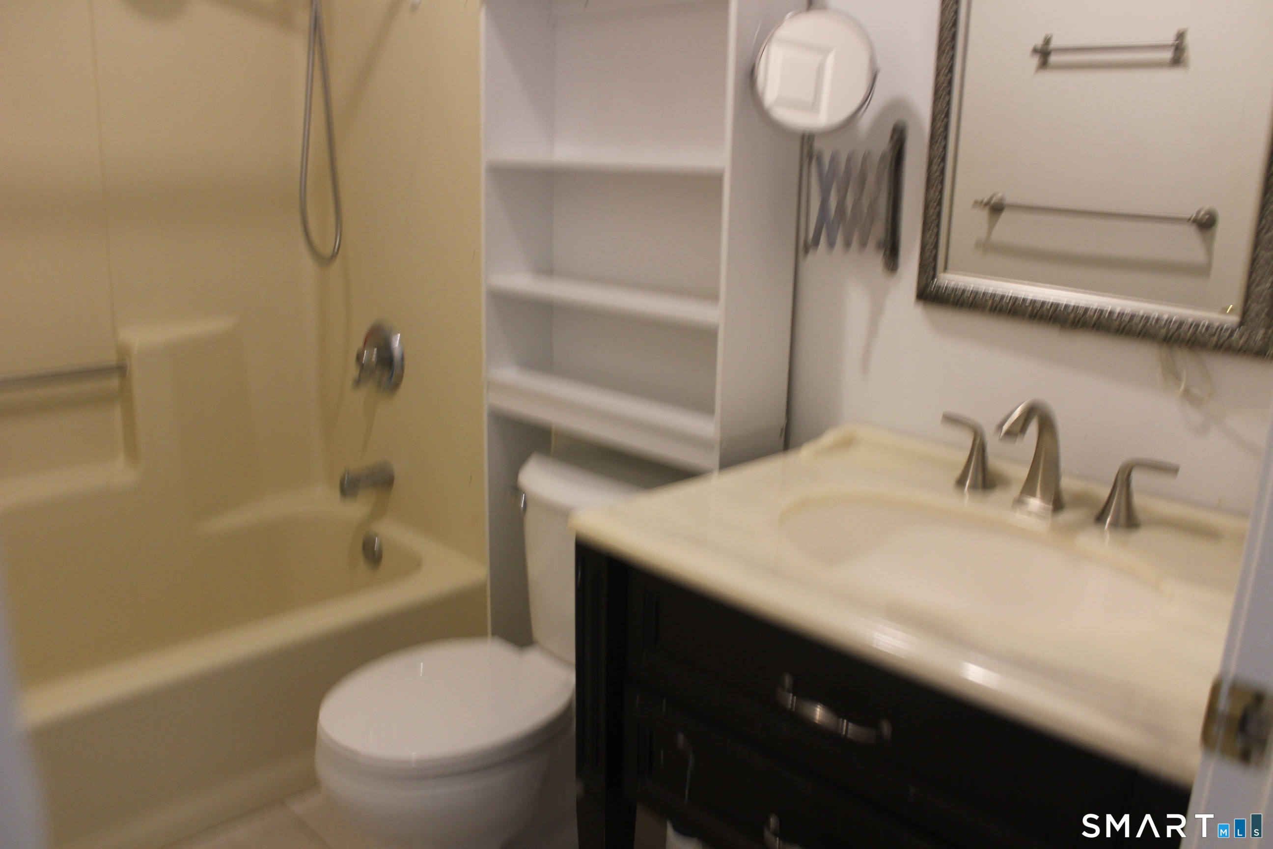1 Concorde Way, Unit B4 Windsor Locks, CT 06096 - Photo 22 of 40 a bathroom with a sink a toilet and a bathtub