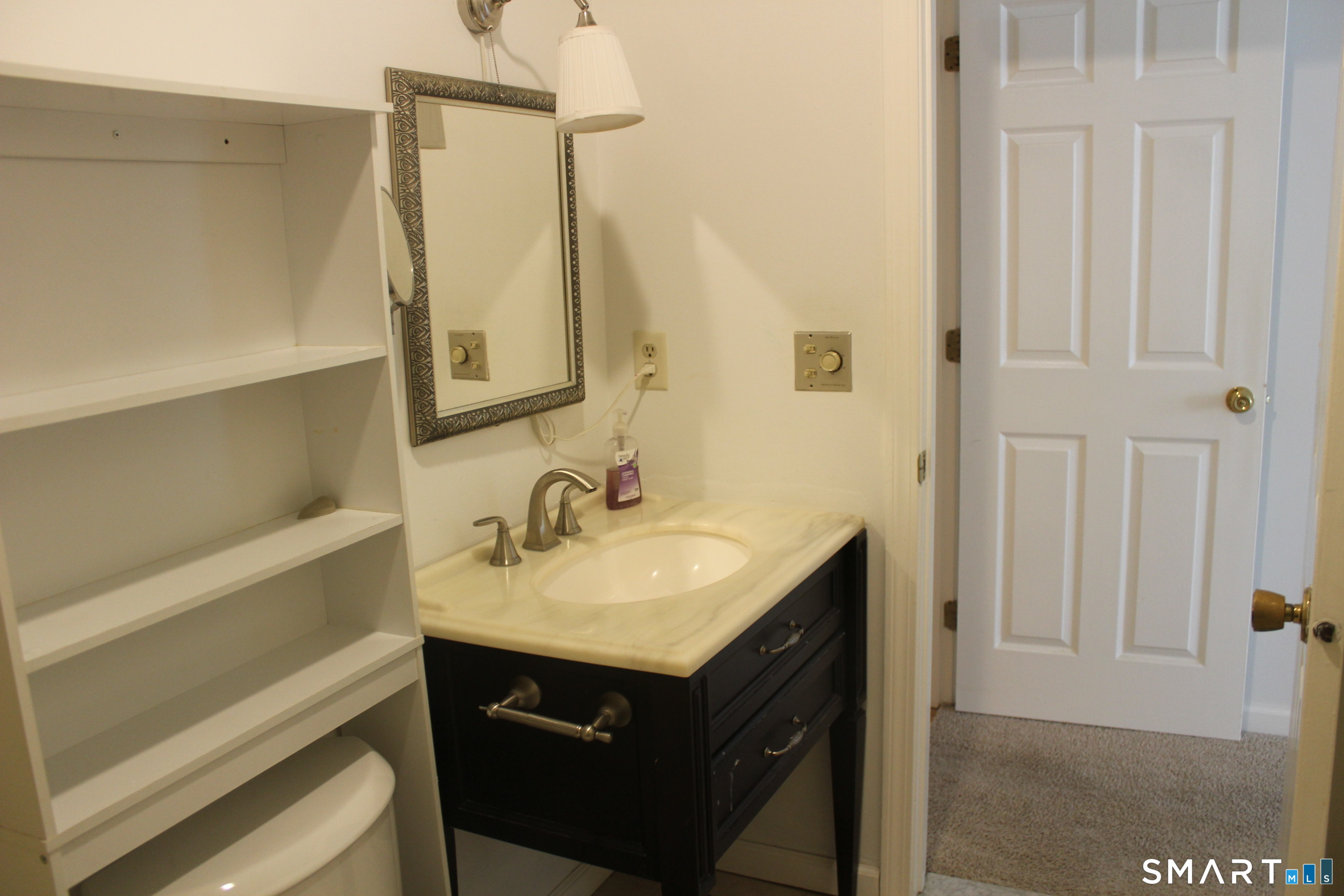 1 Concorde Way, Unit B4 Windsor Locks, CT 06096 - Photo 23 of 40 a bathroom with a sink and a mirror