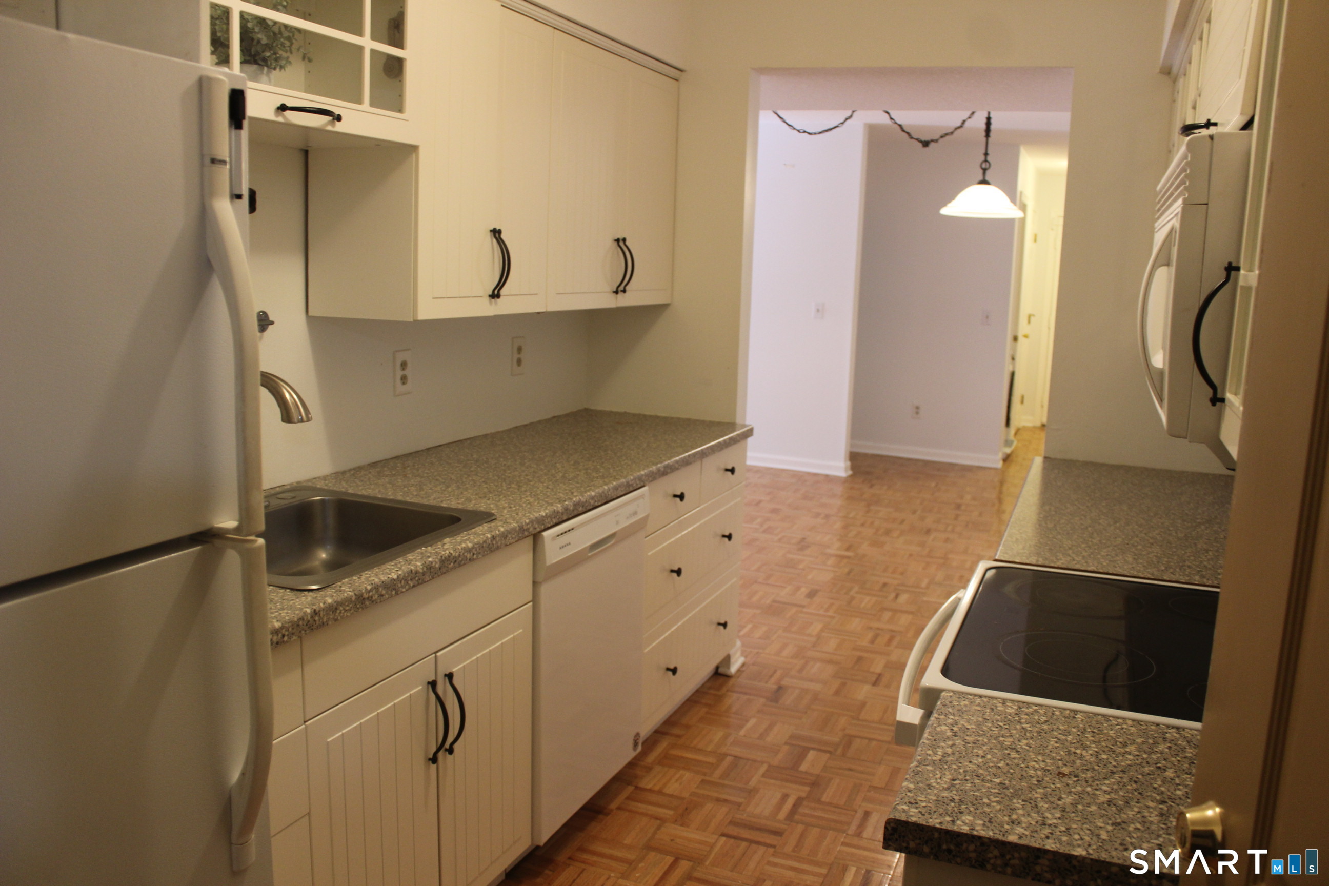 1 Concorde Way, Unit B4 Windsor Locks, CT 06096 - Photo 31 of 40 a kitchen with a sink and a refrigerator