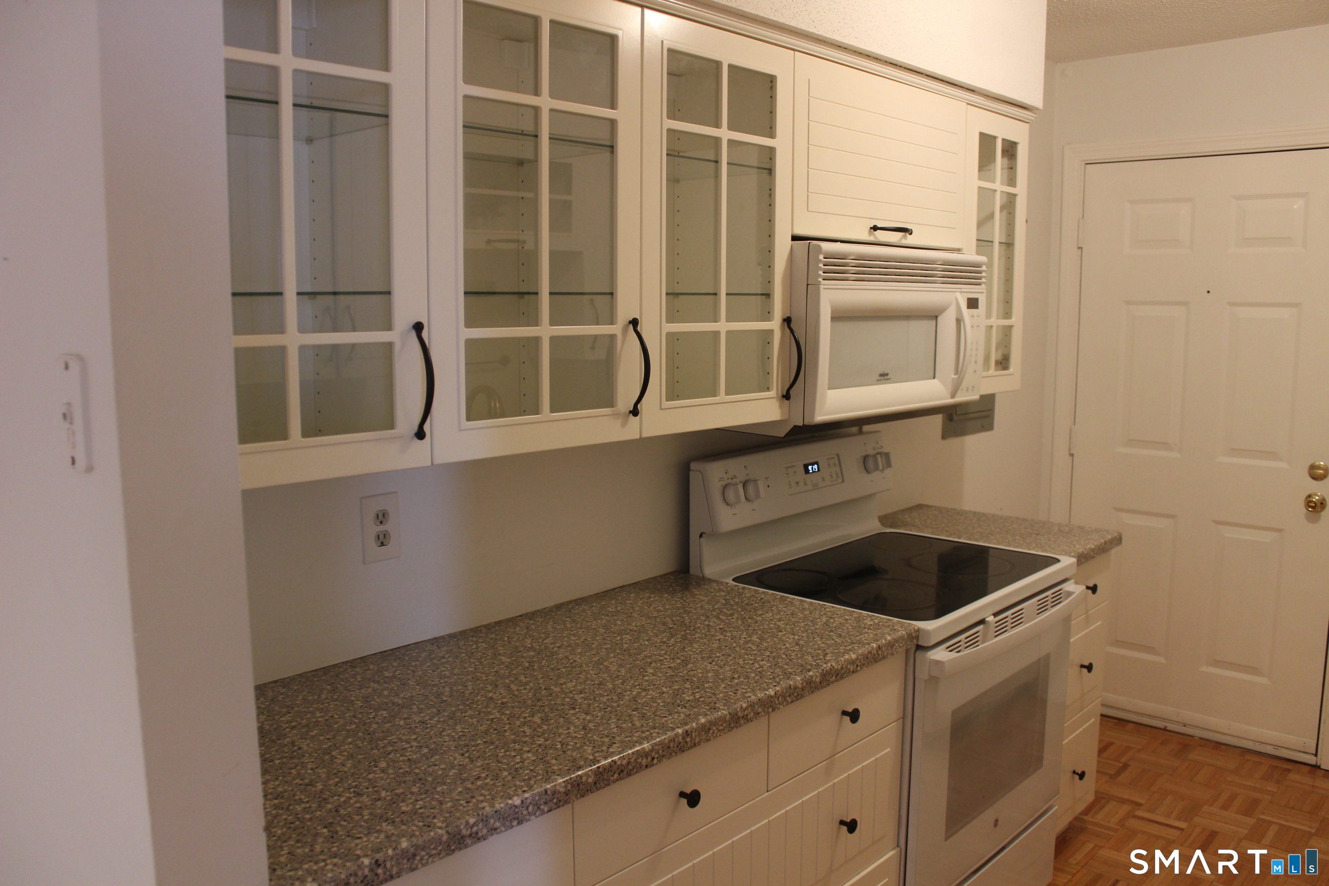 1 Concorde Way, Unit B4 Windsor Locks, CT 06096 - Photo 10 of 40 a kitchen with a cabinets and a stove top oven