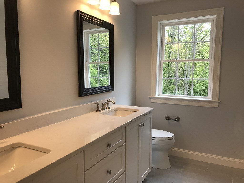53 Wellesley Rd Extension Natick, MA 01760 - Photo 19 of 27 a bathroom with a toilet sink and window